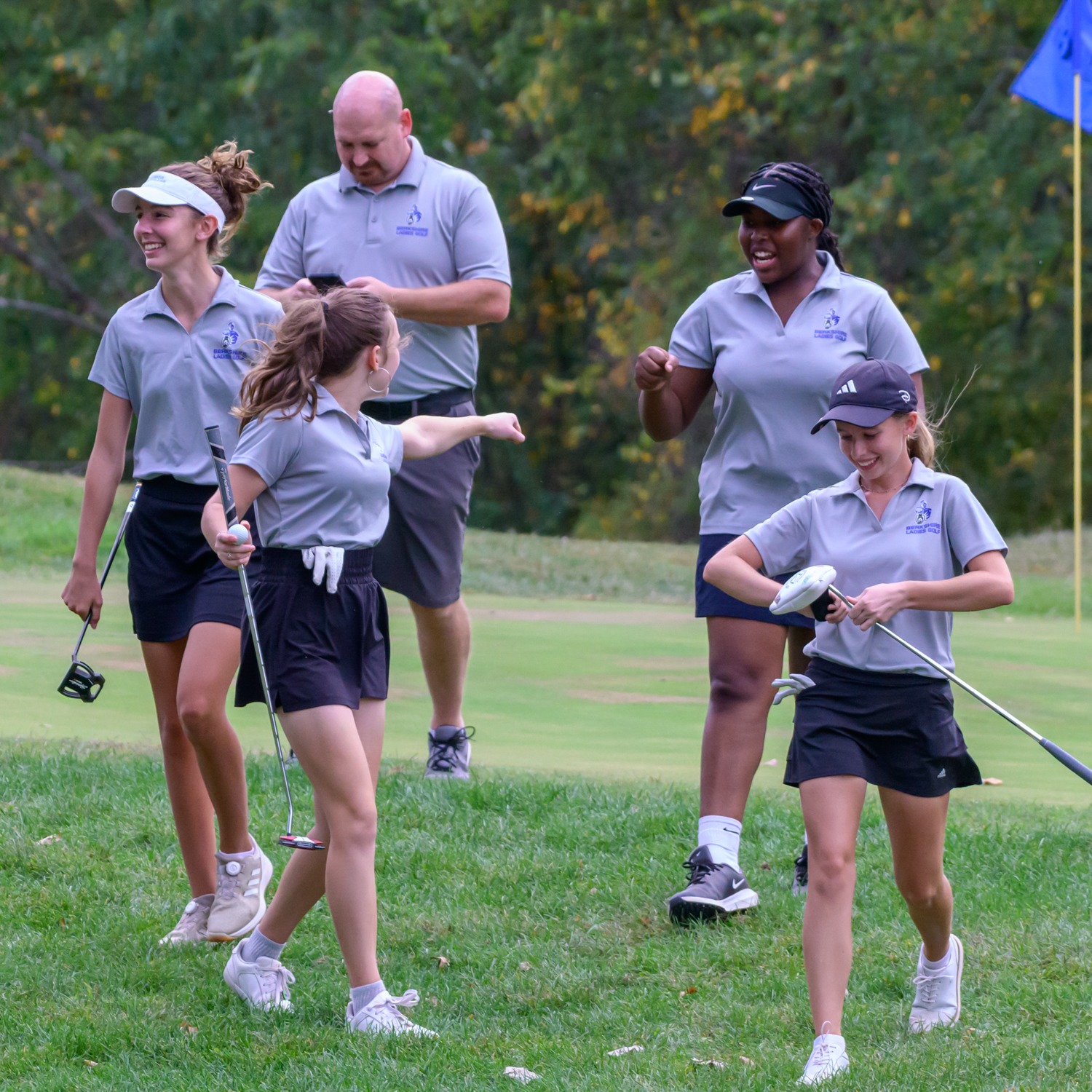 Olivia Huffman and her teammates celebrating an eagle